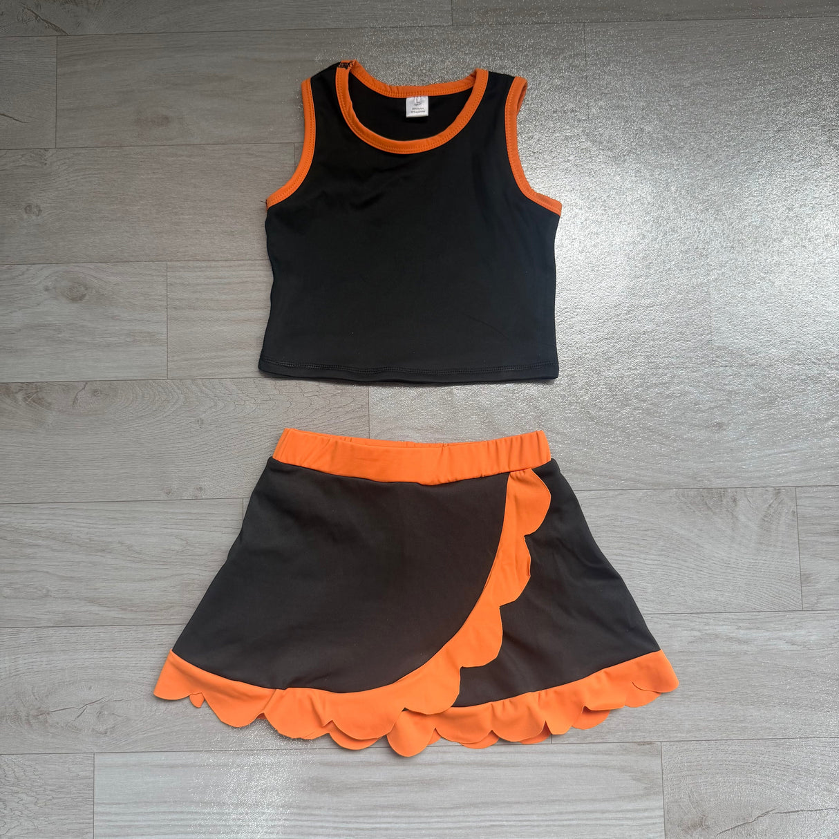 Sleeveless black top orange scallop girls active wear set